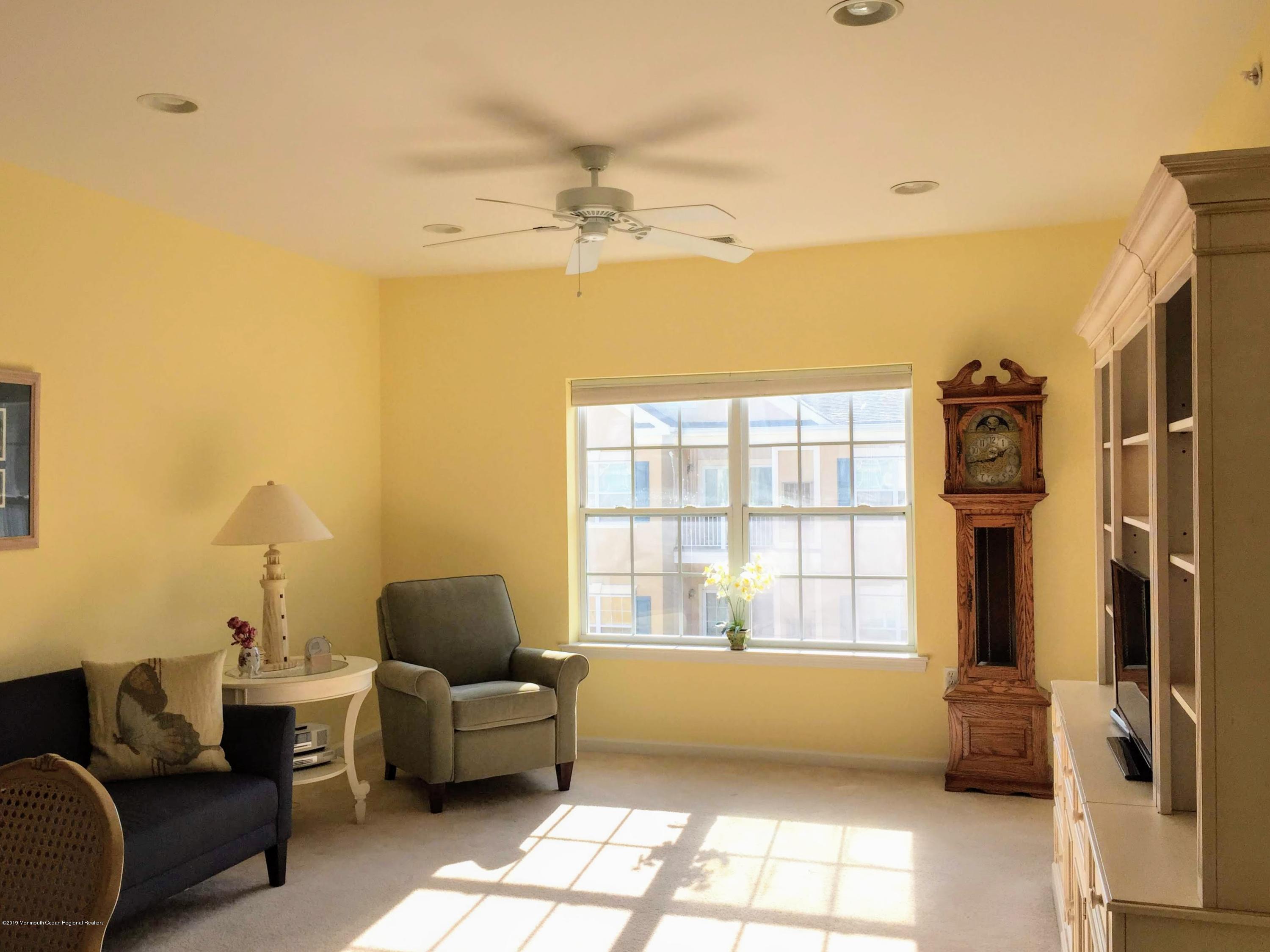 540 Cranbury Road, Unit 419 East Brunswick, NJ 08816 - Photo 11 of 42 a living room with furniture and a window