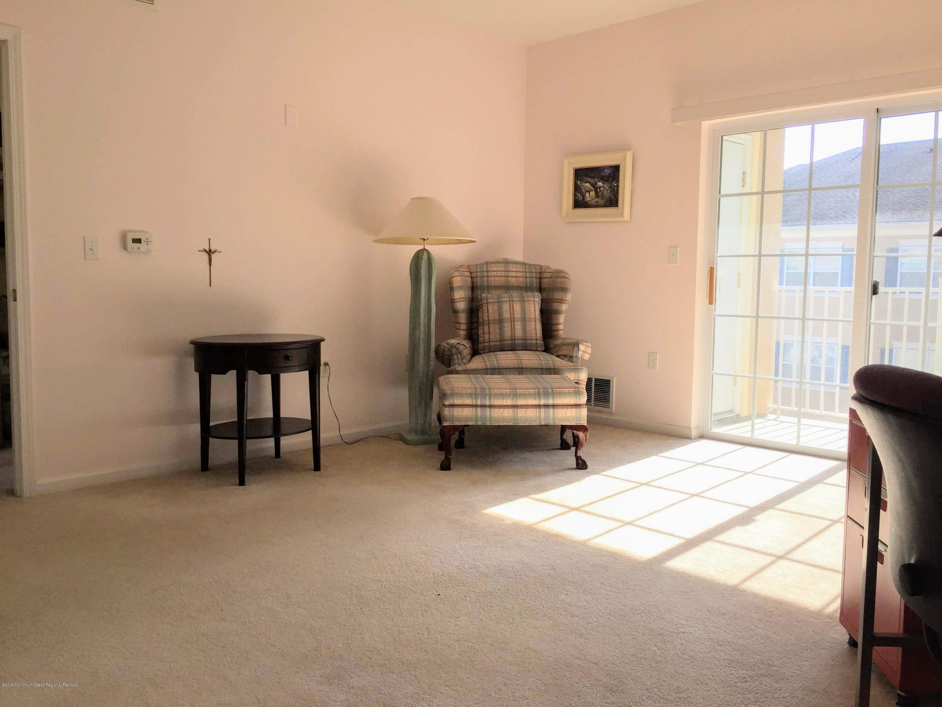 540 Cranbury Road, Unit 419 East Brunswick, NJ 08816 - Photo 17 of 42 a bedroom with furniture and window
