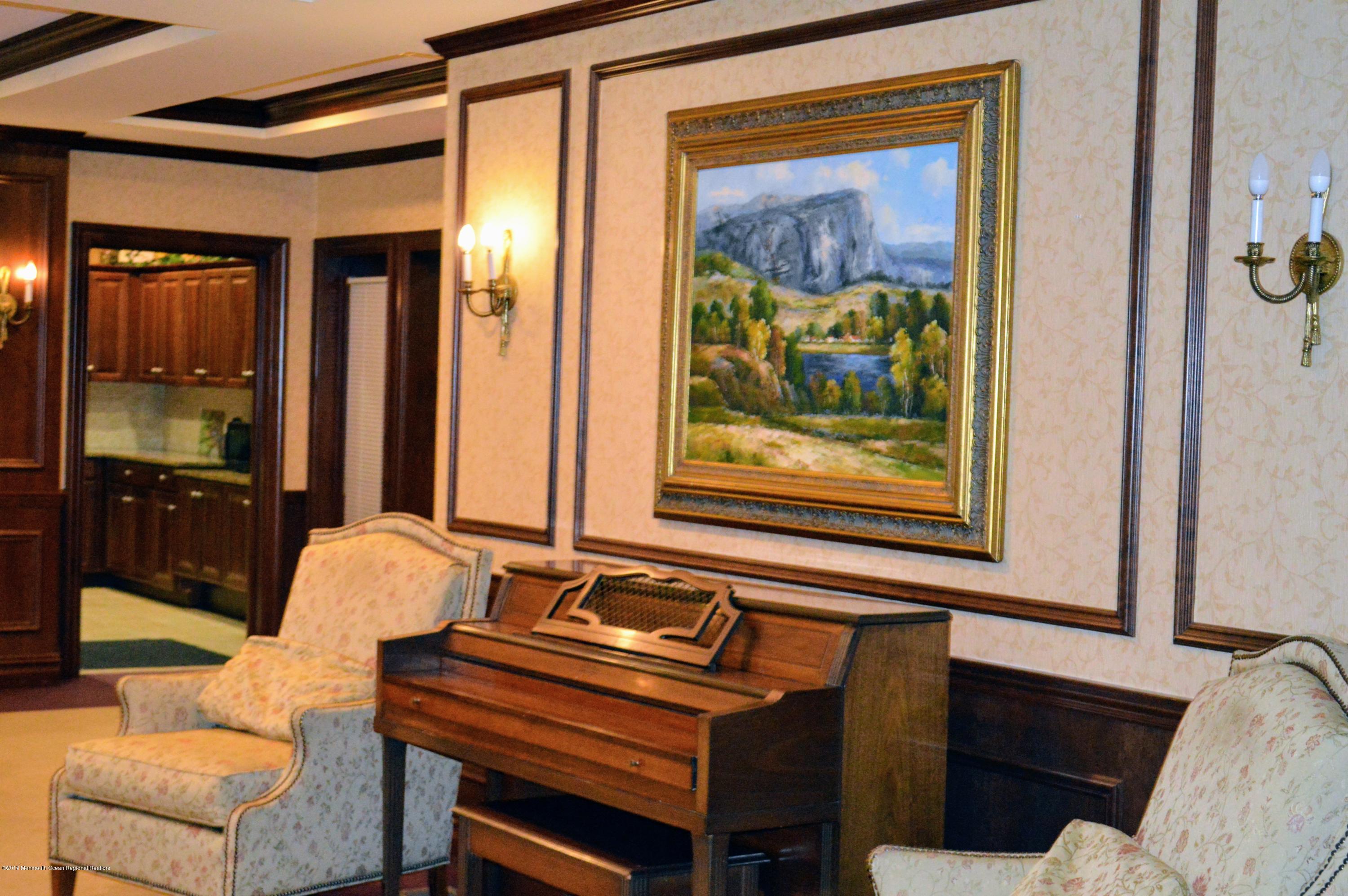 540 Cranbury Road, Unit 419 East Brunswick, NJ 08816 - Photo 27 of 42 a living room with furniture and a painting