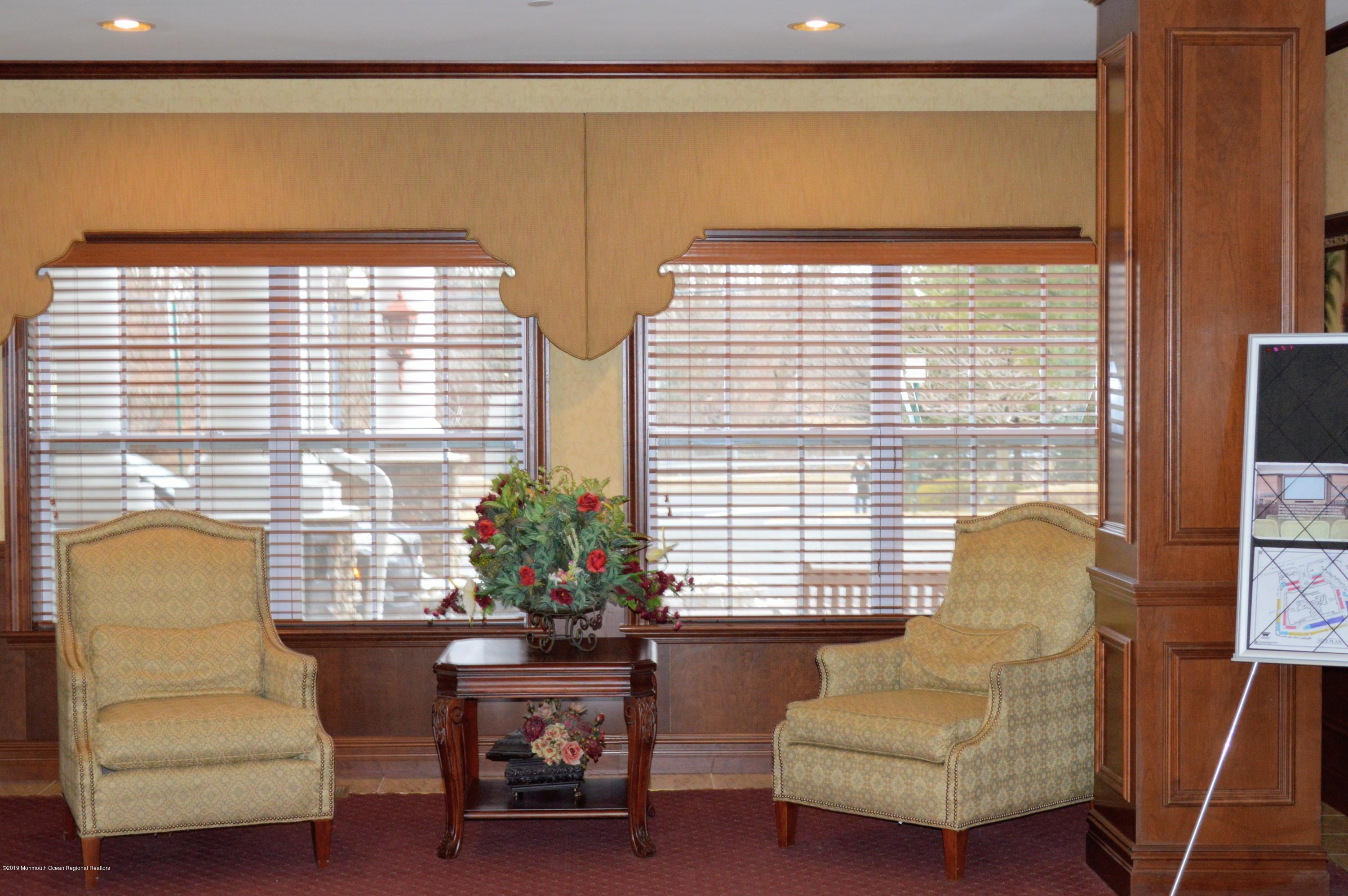 540 Cranbury Road, Unit 419 East Brunswick, NJ 08816 - Photo 32 of 42 a living room with furniture and a potted plant