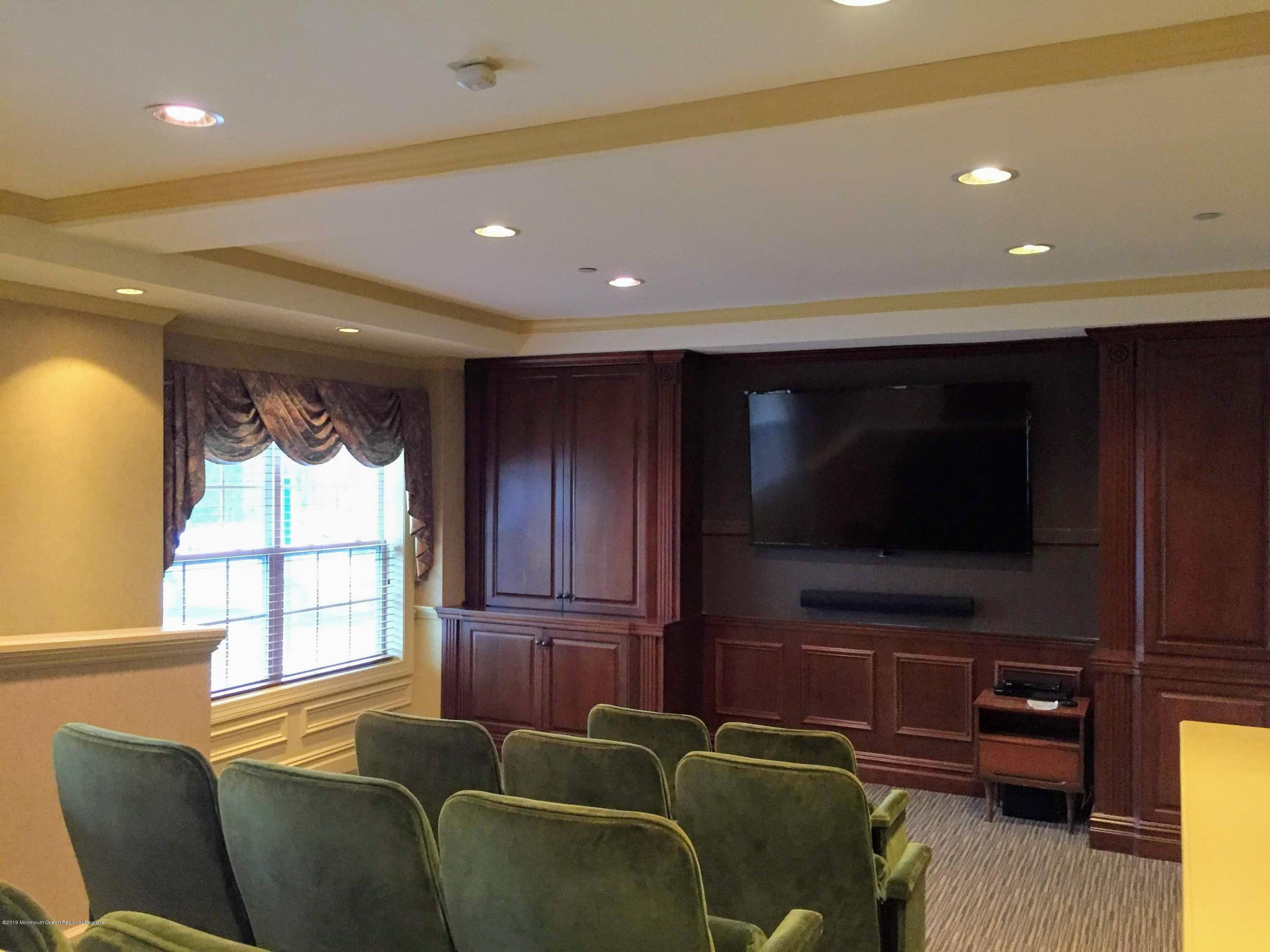 540 Cranbury Road, Unit 419 East Brunswick, NJ 08816 - Photo 34 of 42 a living room with furniture and a flat screen tv