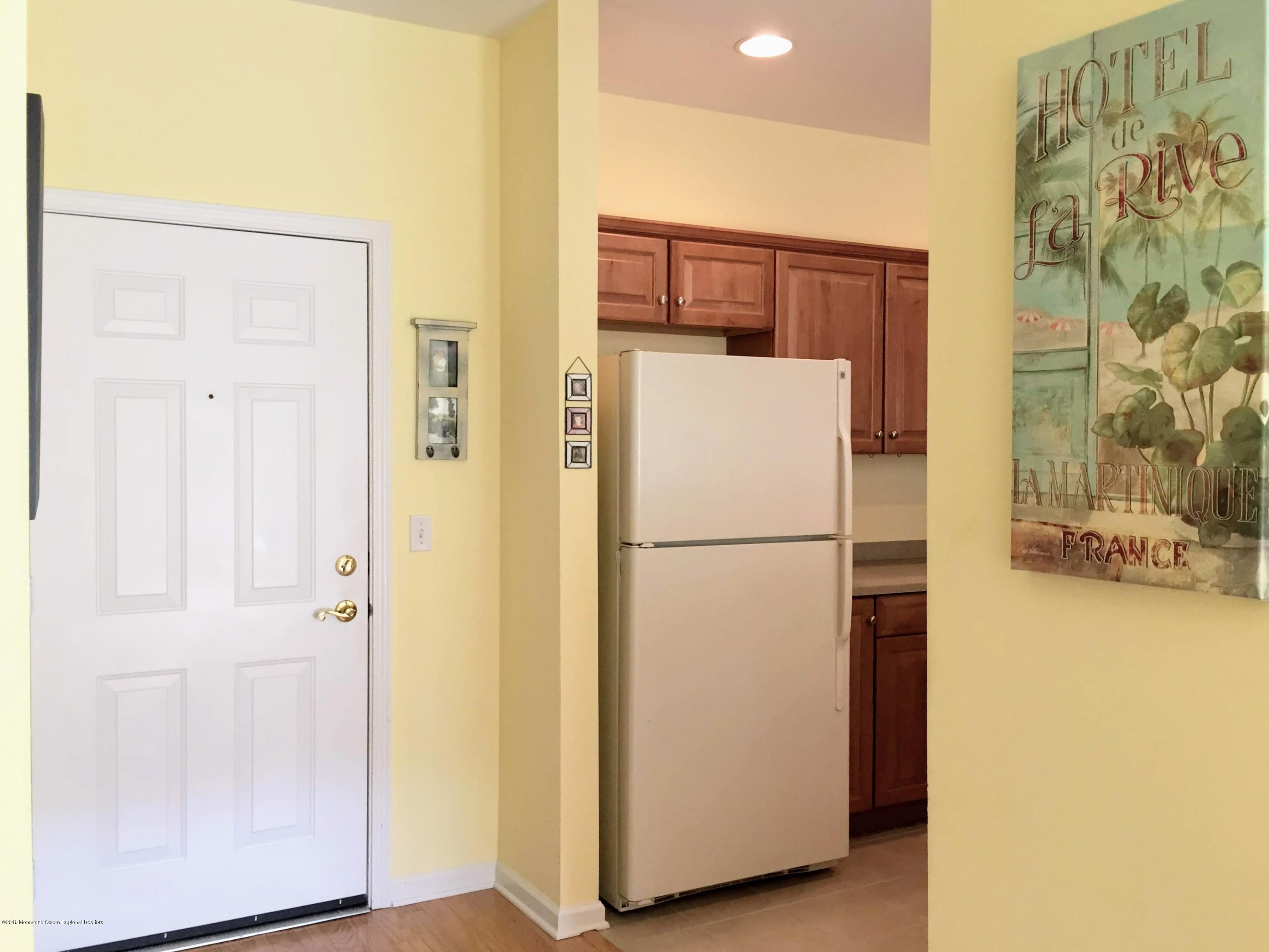 540 Cranbury Road, Unit 419 East Brunswick, NJ 08816 - Photo 4 of 42 a white refrigerator freezer sitting next to a white wall