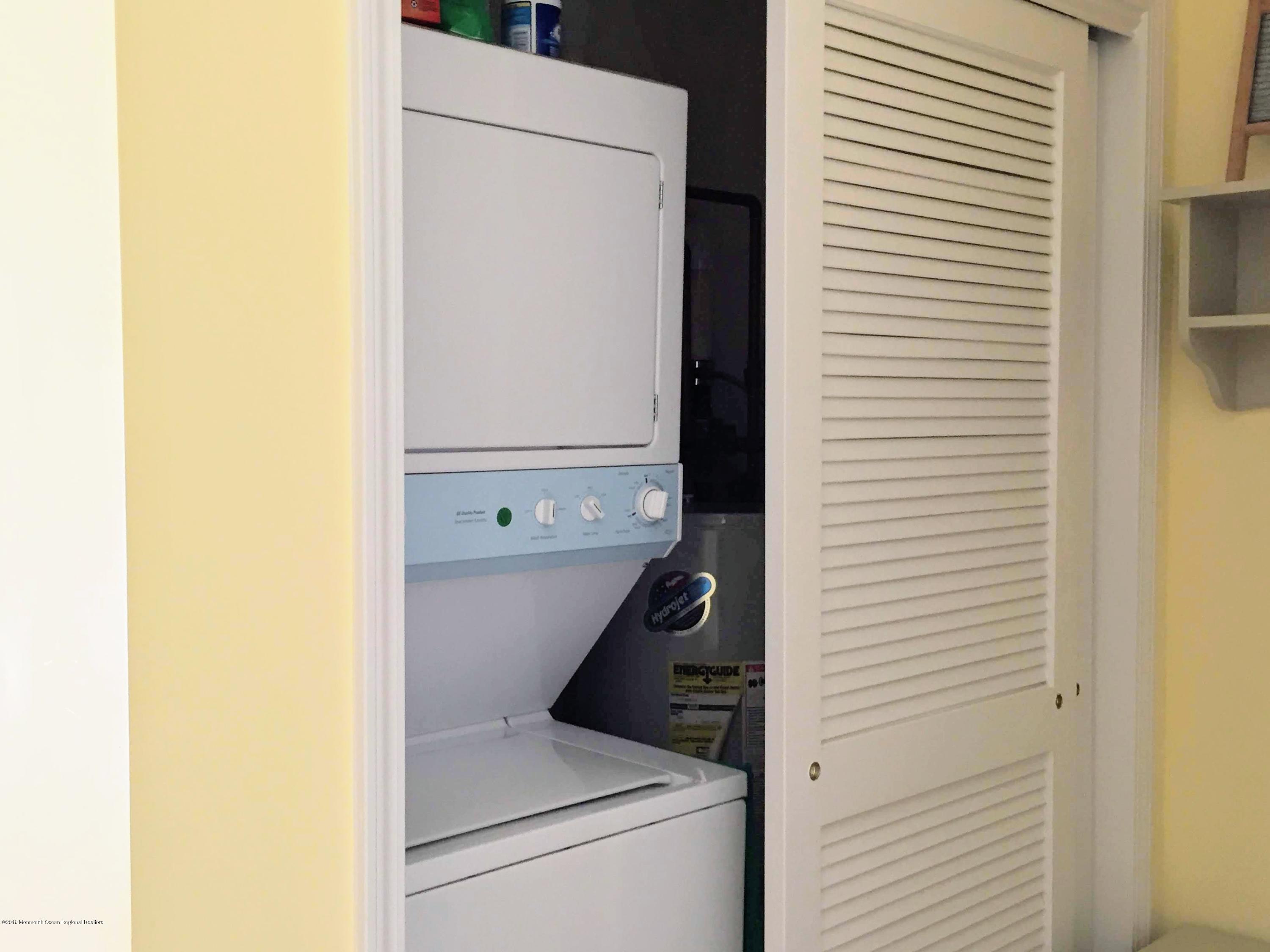 540 Cranbury Road, Unit 419 East Brunswick, NJ 08816 - Photo 8 of 42 a utility room with dryer and washer