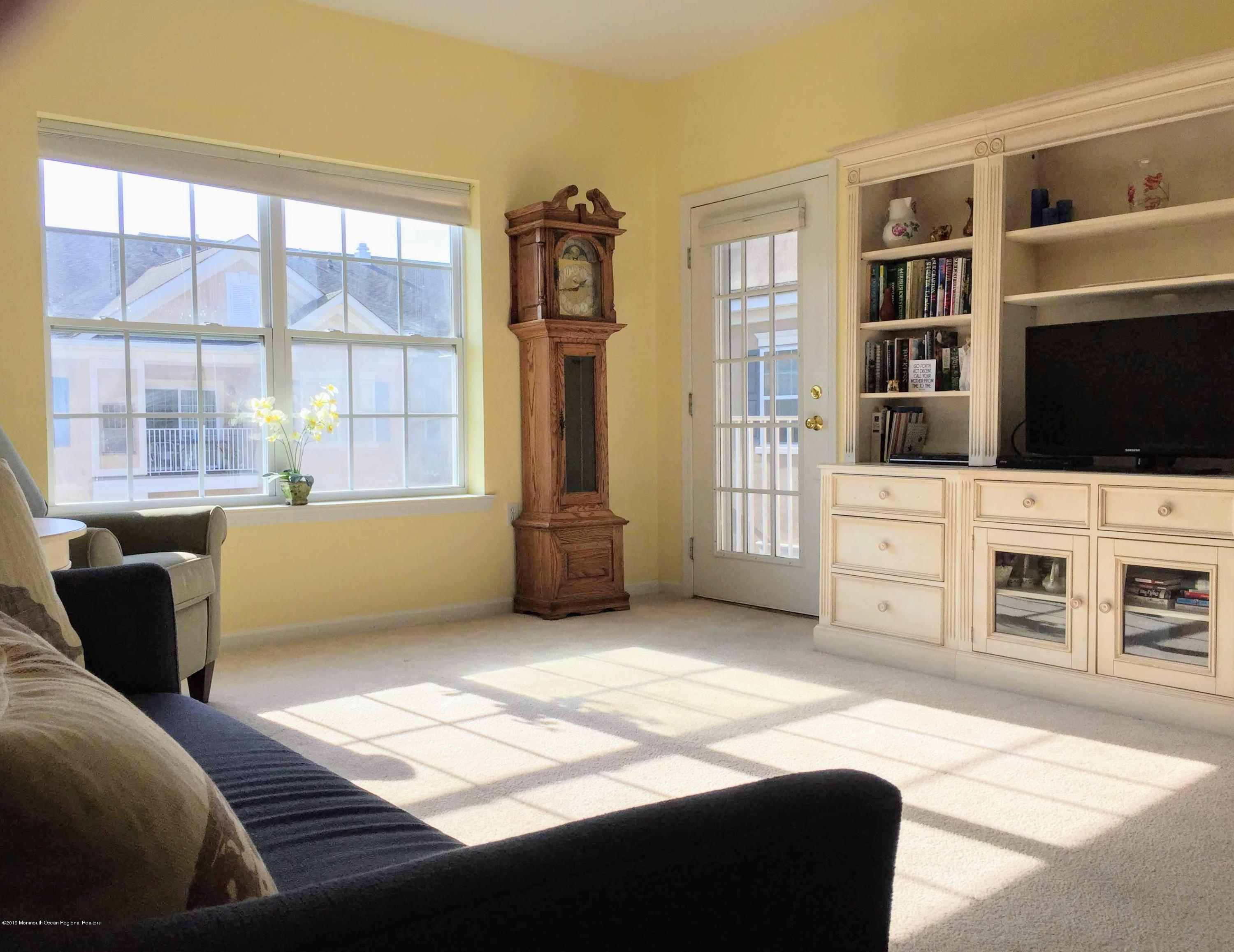 540 Cranbury Road, Unit 419 East Brunswick, NJ 08816 - Photo 10 of 42 a bedroom with a bed and a television