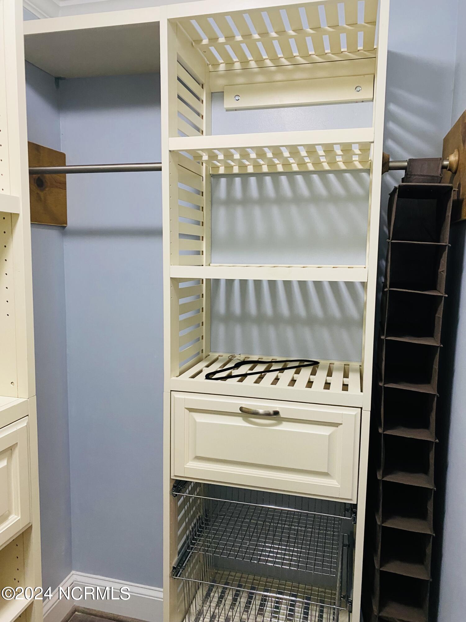 1507 Faro Road Stantonsburg, NC 27883 - Photo 21 of 42 Custom built shelving in Primary Bedroom Closet
