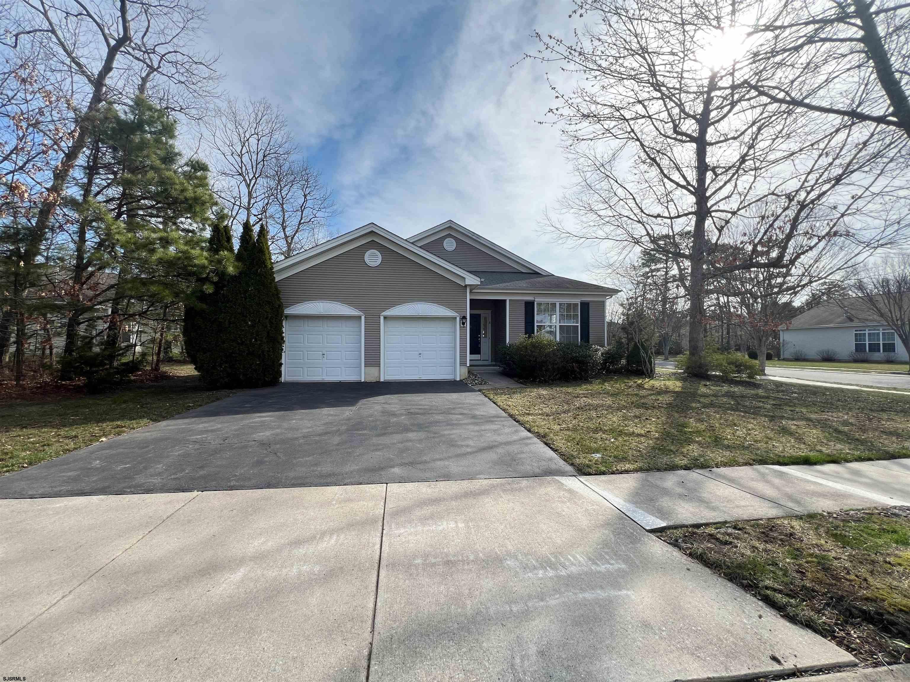 8 Manchester Street Galloway Township, NJ 08205 - Photo 1 of 31 a front view of a house with a yard and garage