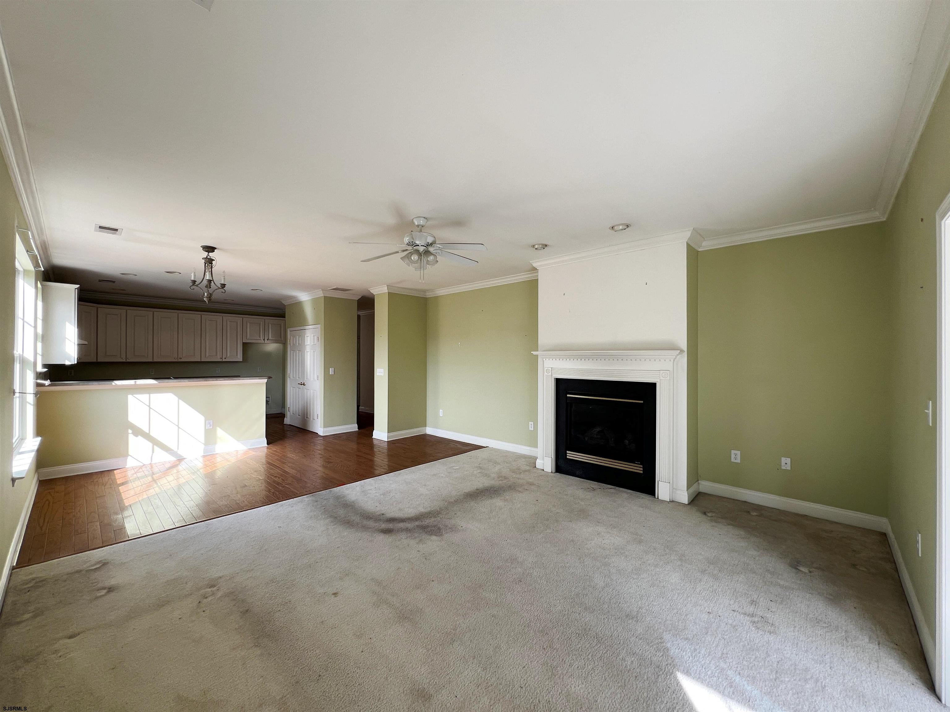 8 Manchester Street Galloway Township, NJ 08205 - Photo 11 of 31 a view of an empty room with a fireplace and a window