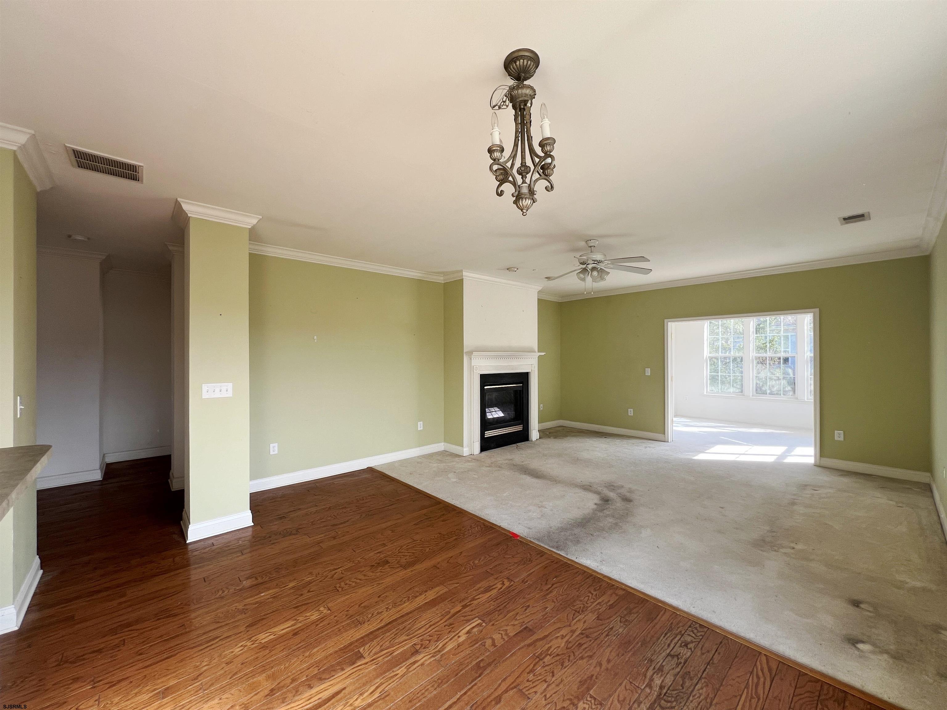 8 Manchester Street Galloway Township, NJ 08205 - Photo 13 of 31 wooden floor in an empty room with a window