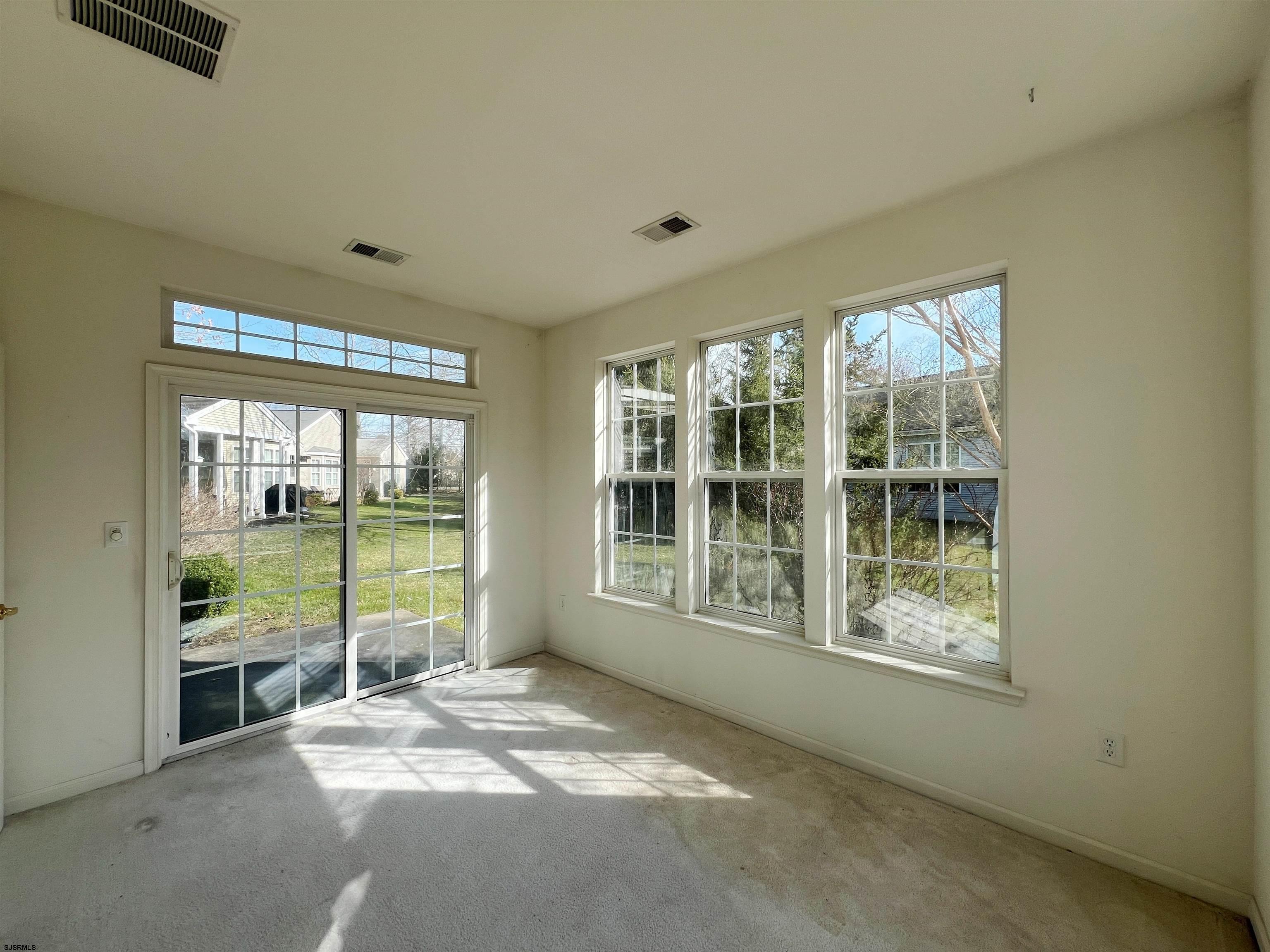 8 Manchester Street Galloway Township, NJ 08205 - Photo 15 of 31 a view of an empty room with windows and a balcony
