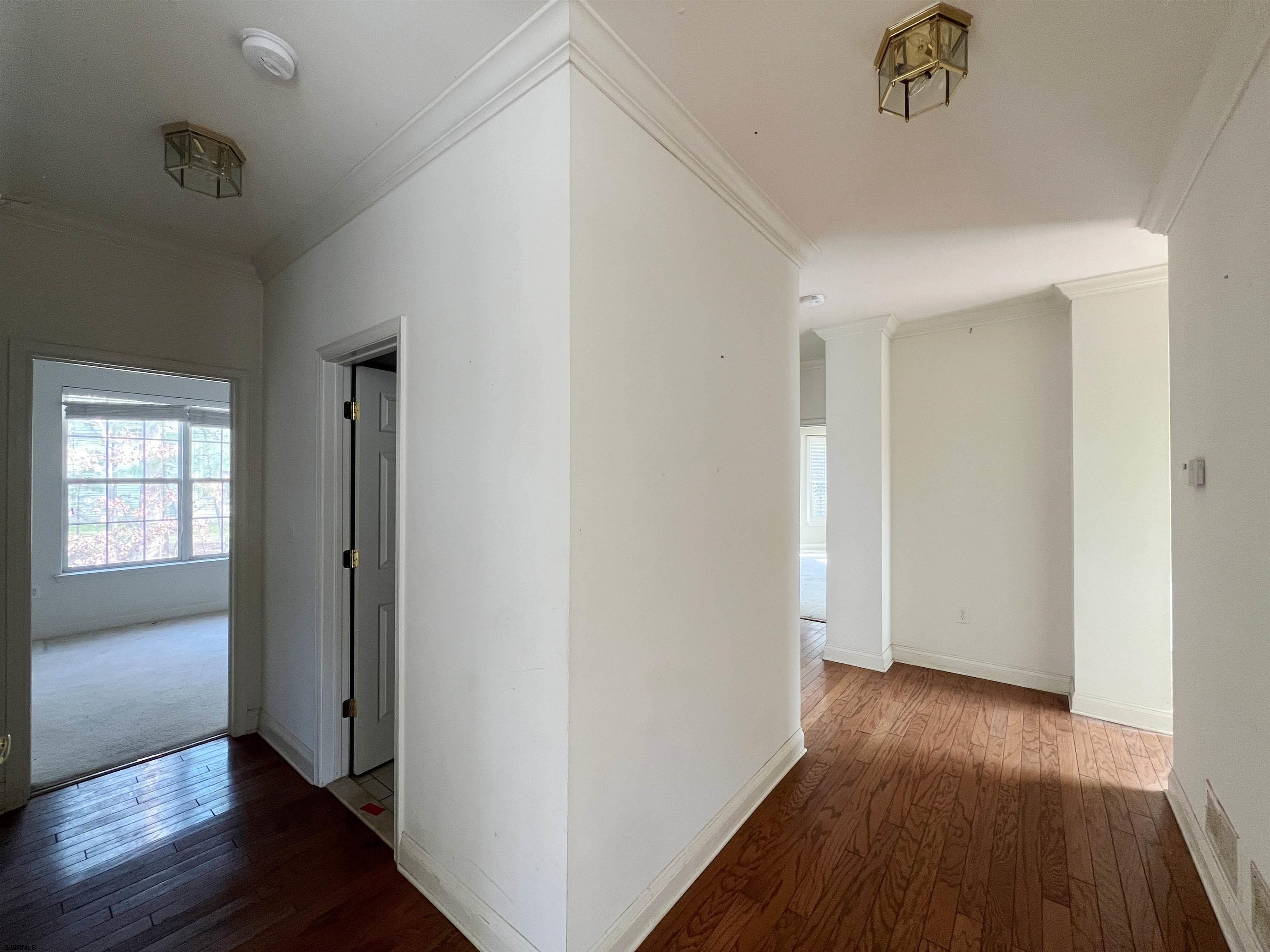 8 Manchester Street Galloway Township, NJ 08205 - Photo 16 of 31 an empty room with wooden floor and windows