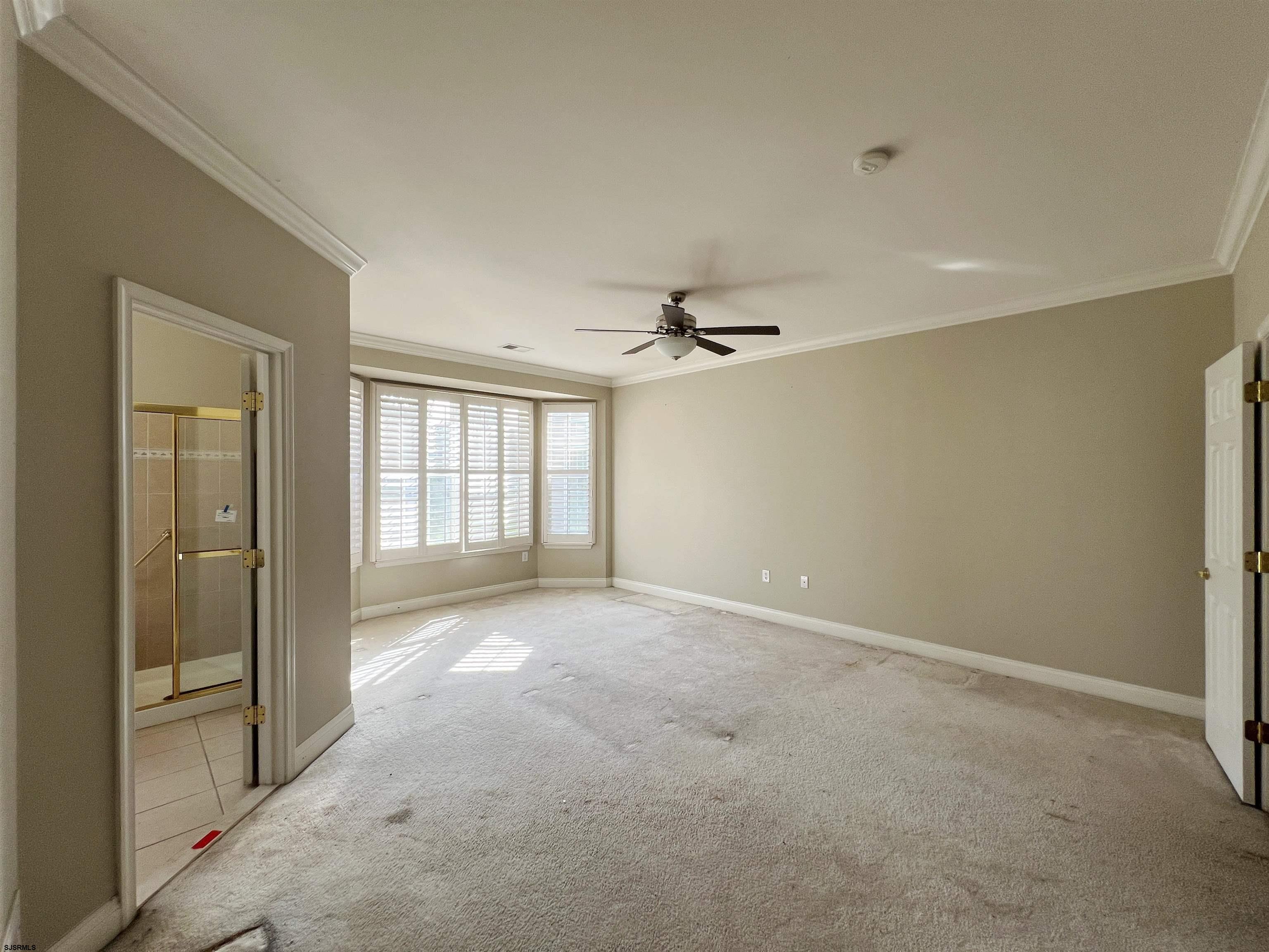 8 Manchester Street Galloway Township, NJ 08205 - Photo 18 of 31 en empty room with windows and cabinet