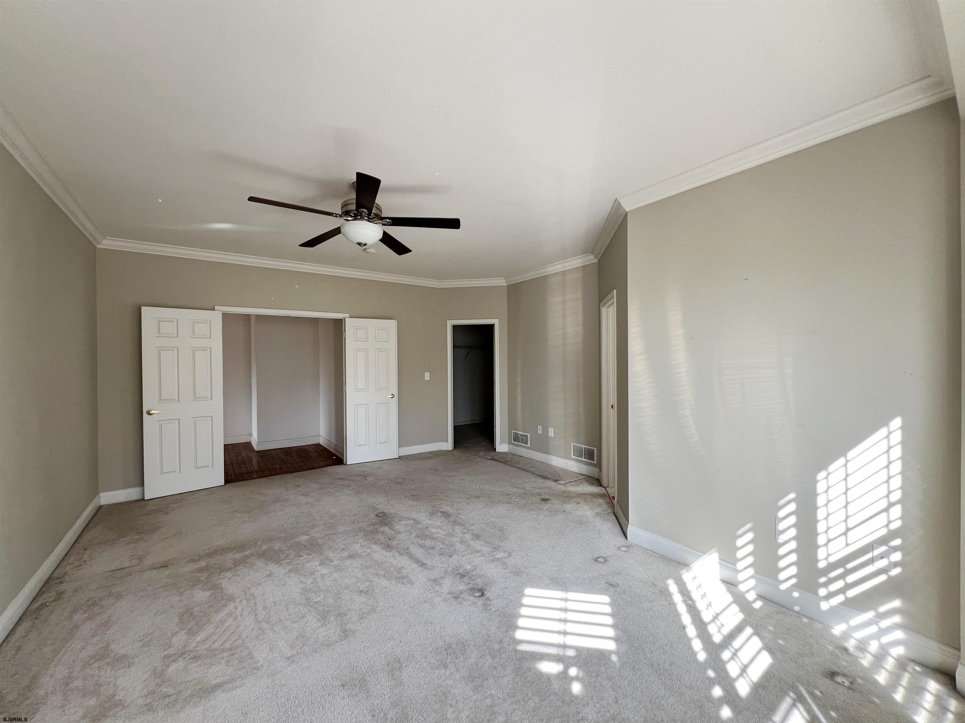8 Manchester Street Galloway Township, NJ 08205 - Photo 19 of 31 a view of empty room with wooden floor and window