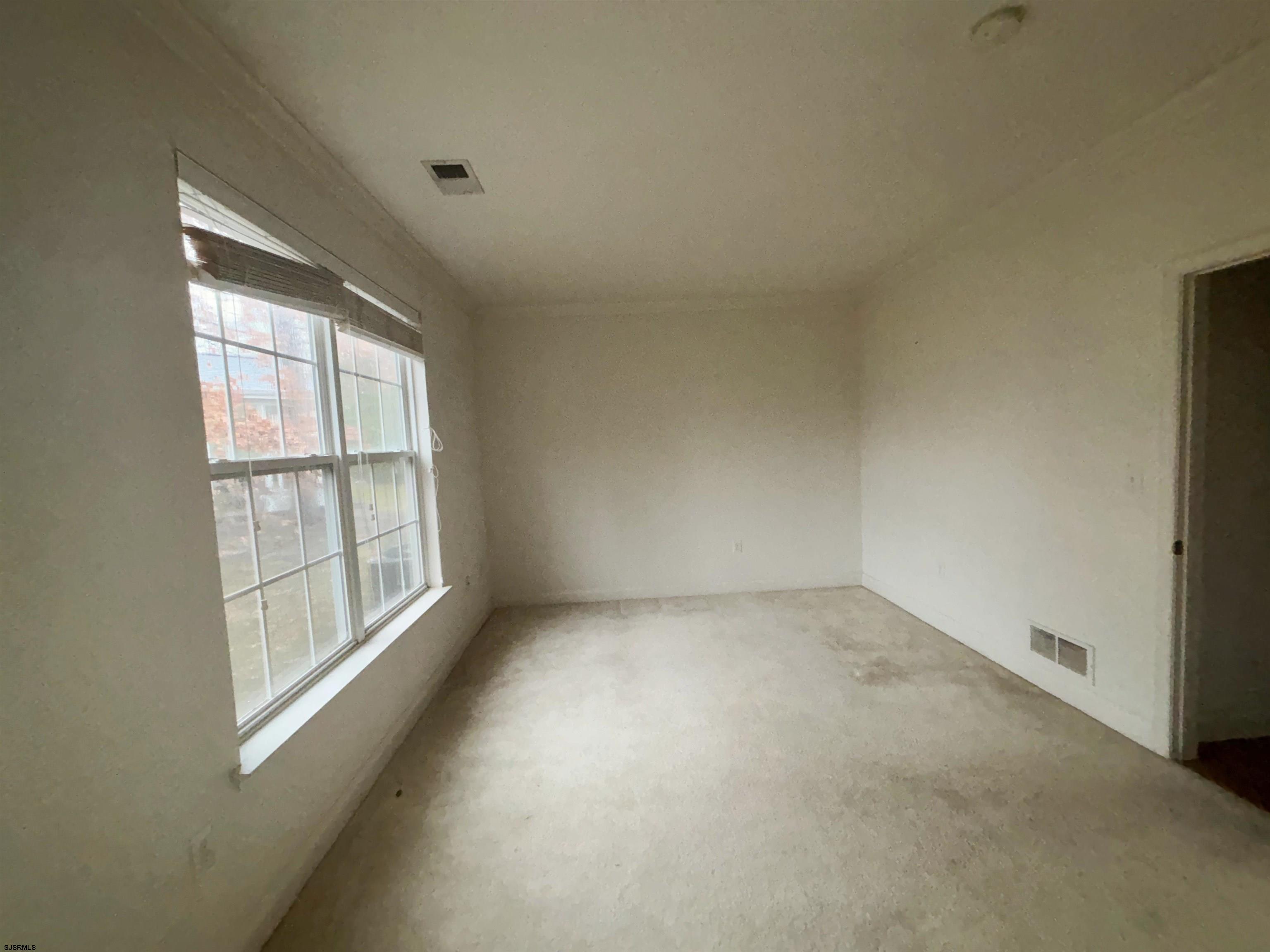 8 Manchester Street Galloway Township, NJ 08205 - Photo 25 of 31 an empty room with a window