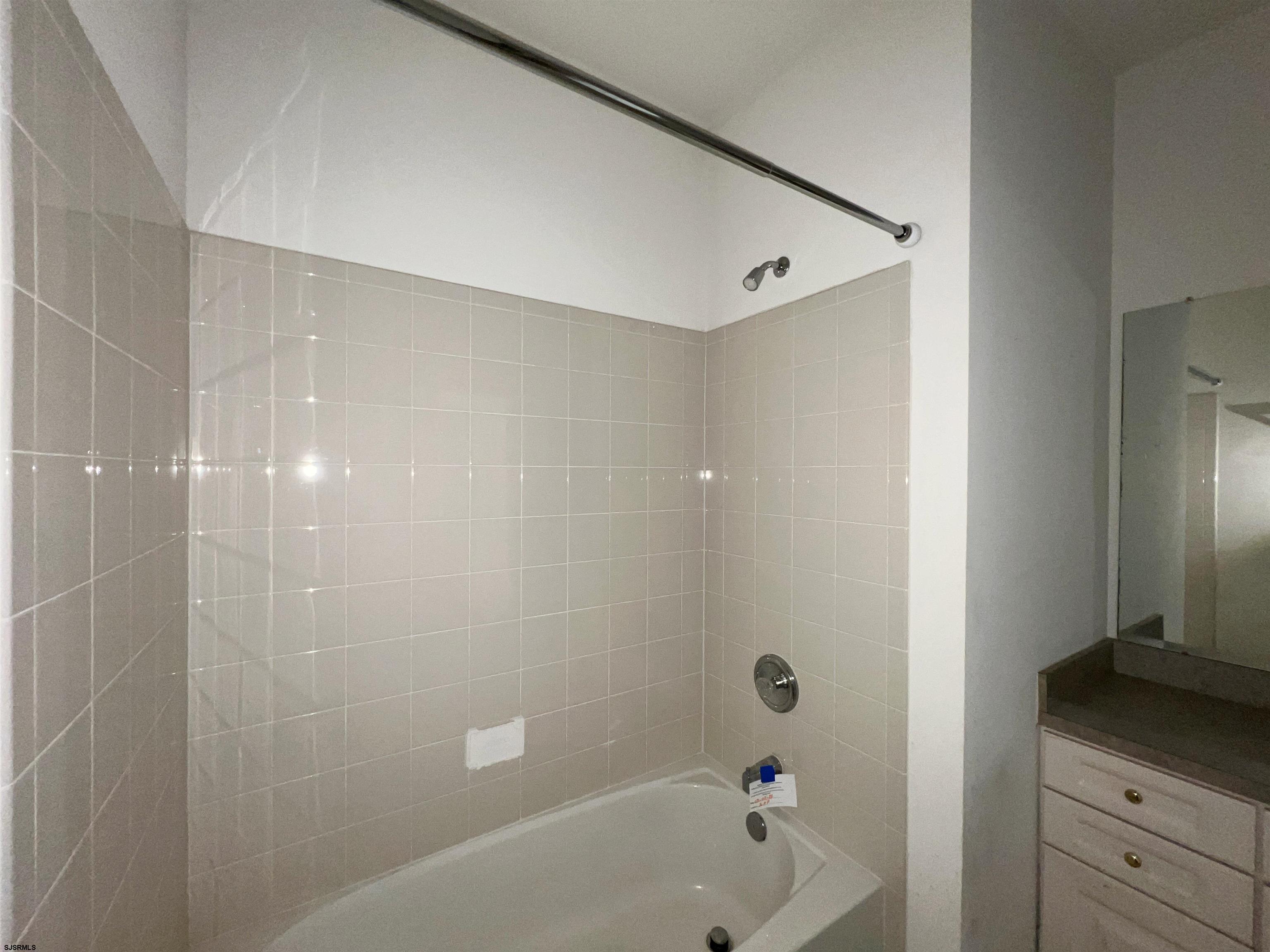8 Manchester Street Galloway Township, NJ 08205 - Photo 27 of 31 a bathroom with a bathtub and a shower
