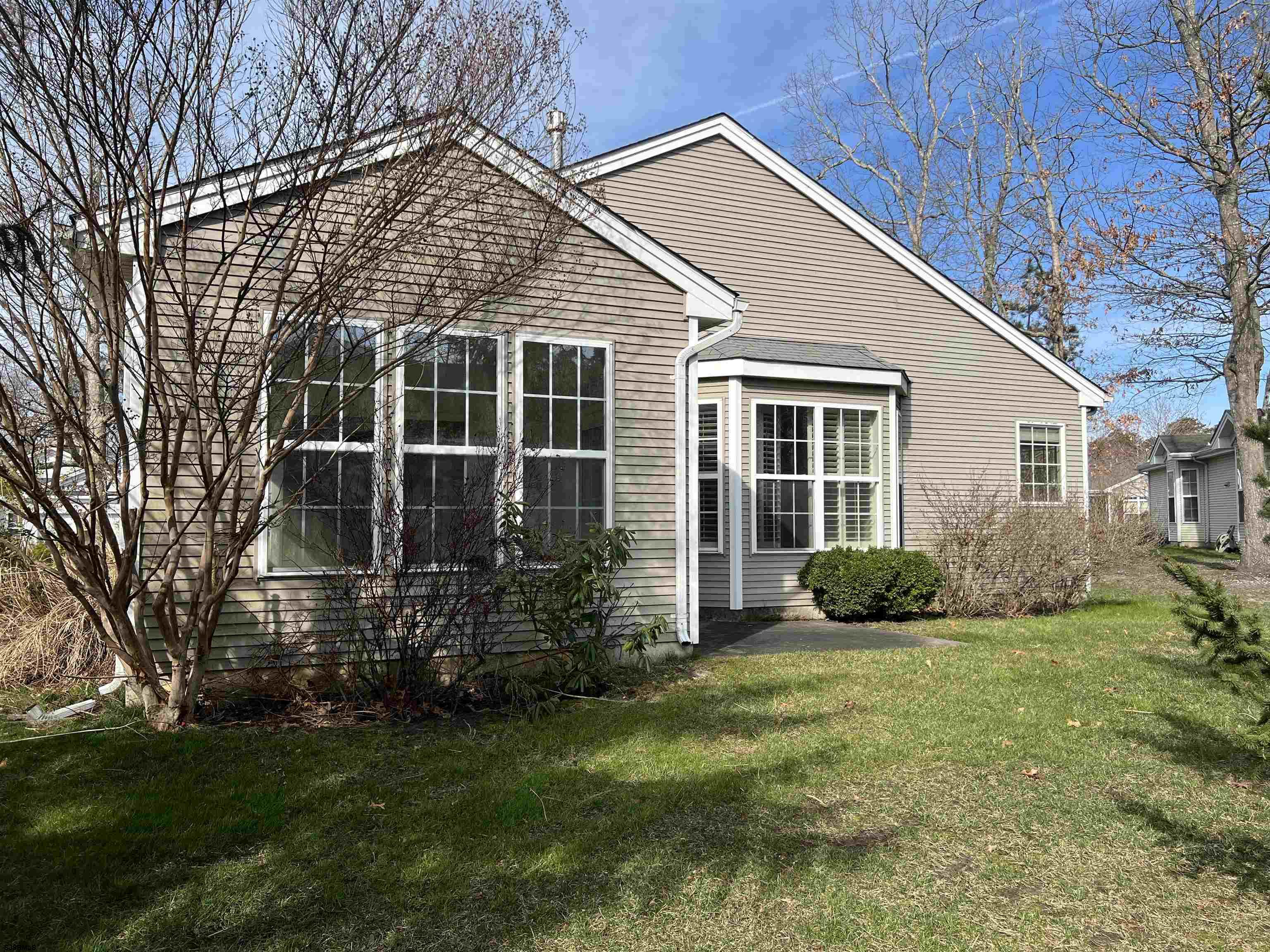 8 Manchester Street Galloway Township, NJ 08205 - Photo 29 of 31 a view of a house with a yard and sitting area