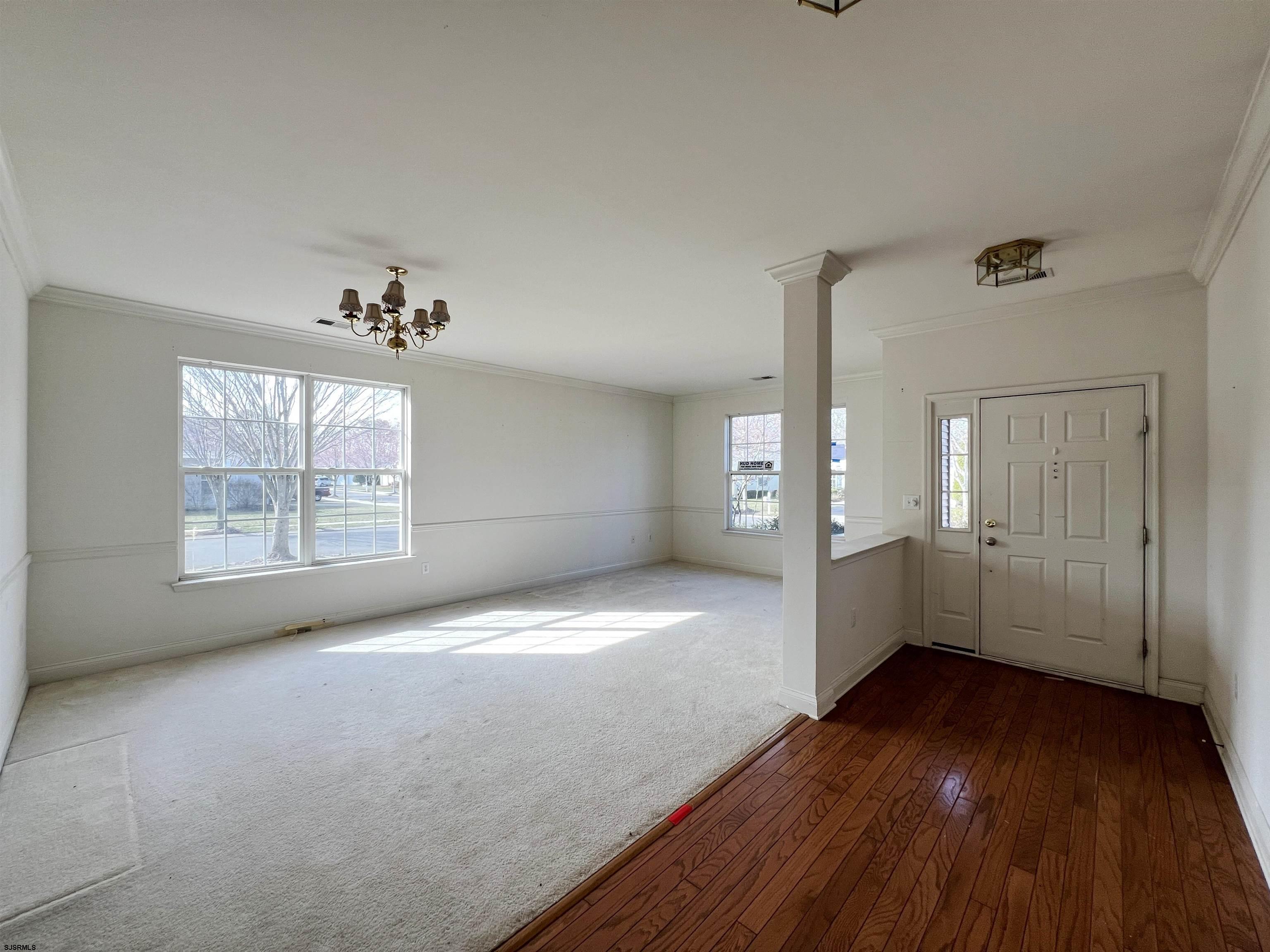 8 Manchester Street Galloway Township, NJ 08205 - Photo 4 of 31 a view of empty room with wooden floor and fan