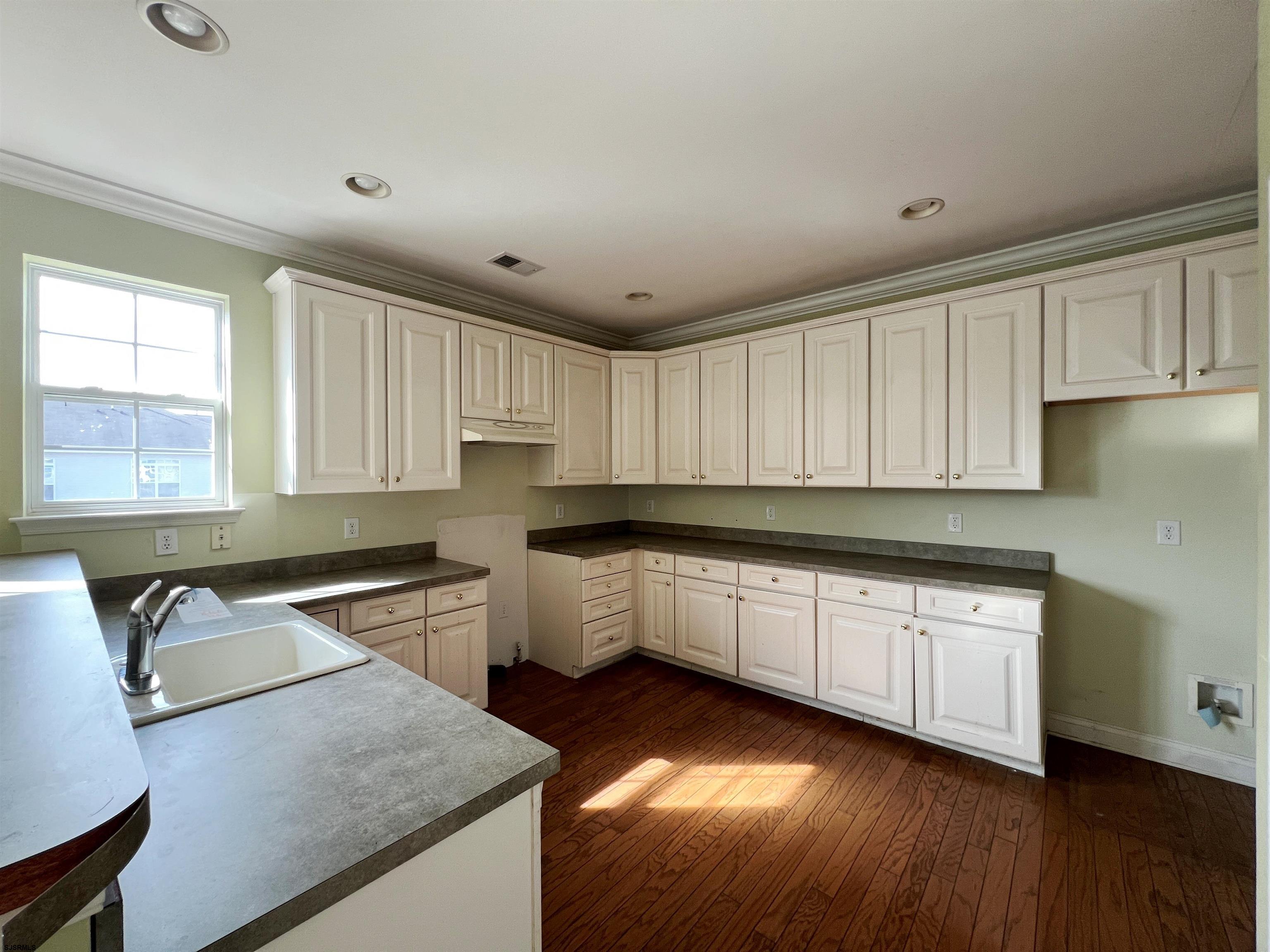 8 Manchester Street Galloway Township, NJ 08205 - Photo 8 of 31 a kitchen with granite countertop a sink a stove cabinets and wooden floor