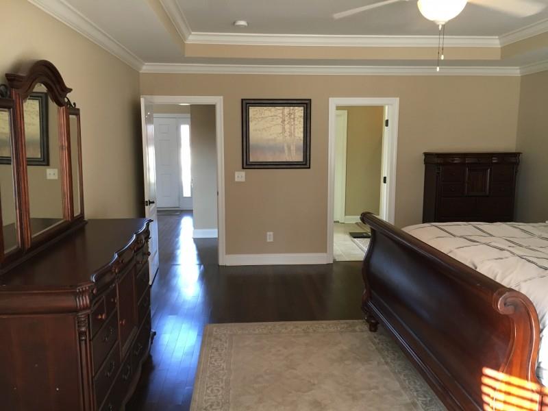 2012 Lincoln Road Spring Hill, TN 37174 - Photo 14 of 25 a kitchen with kitchen island a counter top space a sink and wooden floor