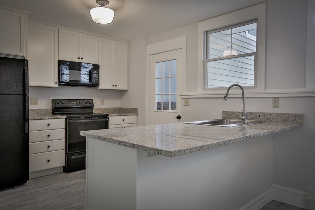 22 Marble Road Gloucester, MA 01930 - Photo 14 of 25 a kitchen with appliances a sink and cabinets