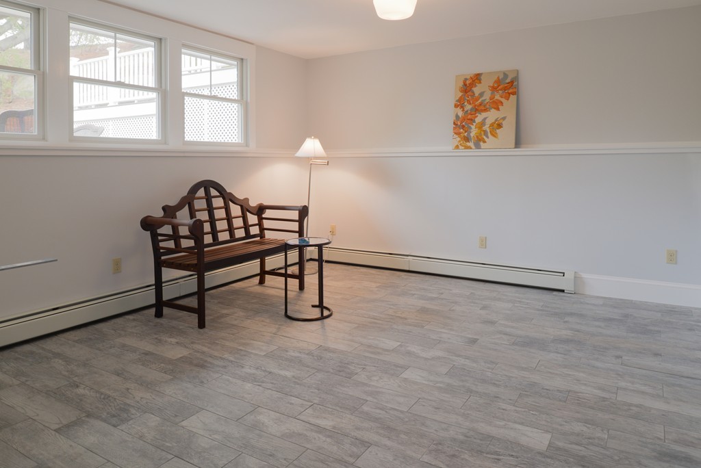 22 Marble Road Gloucester, MA 01930 - Photo 15 of 25 an empty room with windows and ceiling fan