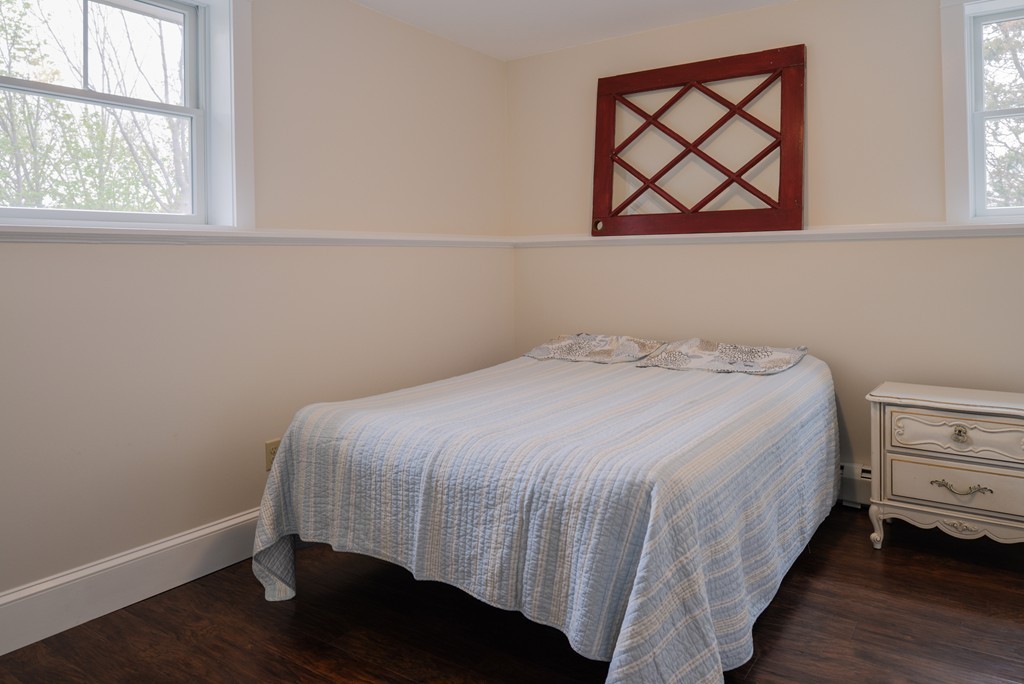 22 Marble Road Gloucester, MA 01930 - Photo 17 of 25 a bedroom with a bed and wooden floor