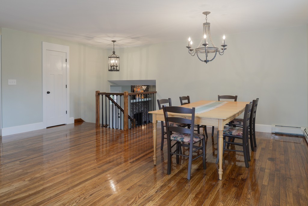 22 Marble Road Gloucester, MA 01930 - Photo 4 of 25 a view of a dining room with furniture wooden floor and chandelier