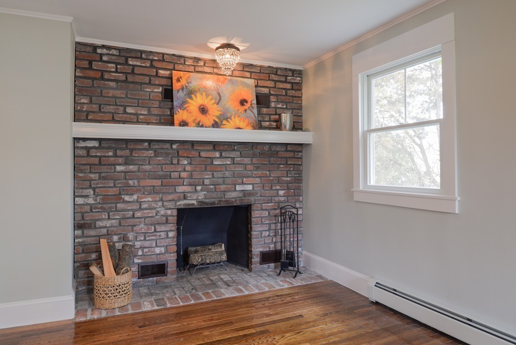22 Marble Road Gloucester, MA 01930 - Photo 5 of 25 a living room with furniture and a fireplace