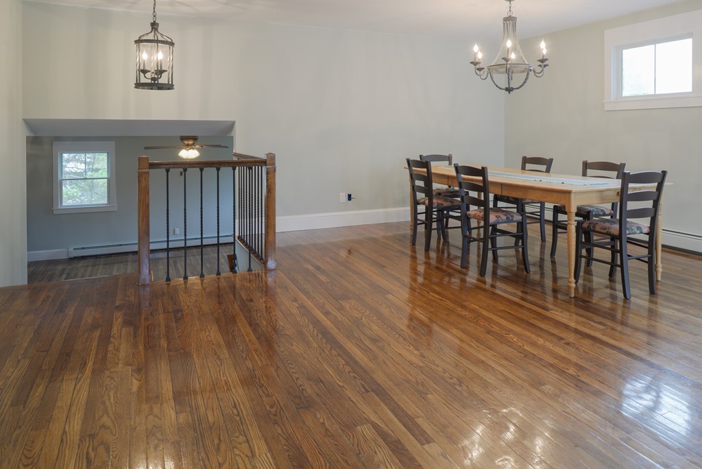 22 Marble Road Gloucester, MA 01930 - Photo 8 of 25 a view of a dining room with furniture wooden floor and chandelier