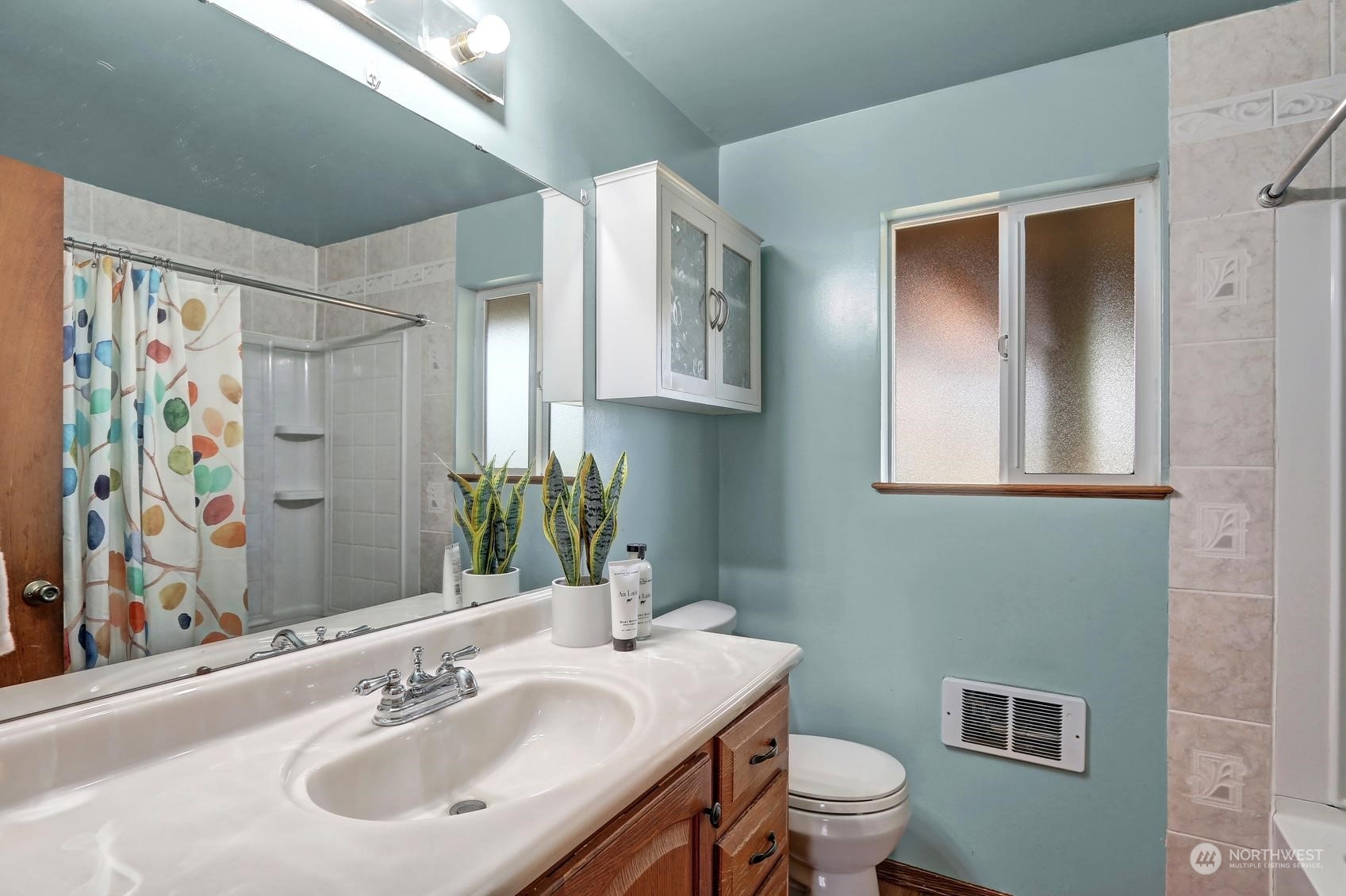2303 Burley Drive Everett, WA 98208 - Photo 11 of 22 a bathroom with a sink a toilet and mirror