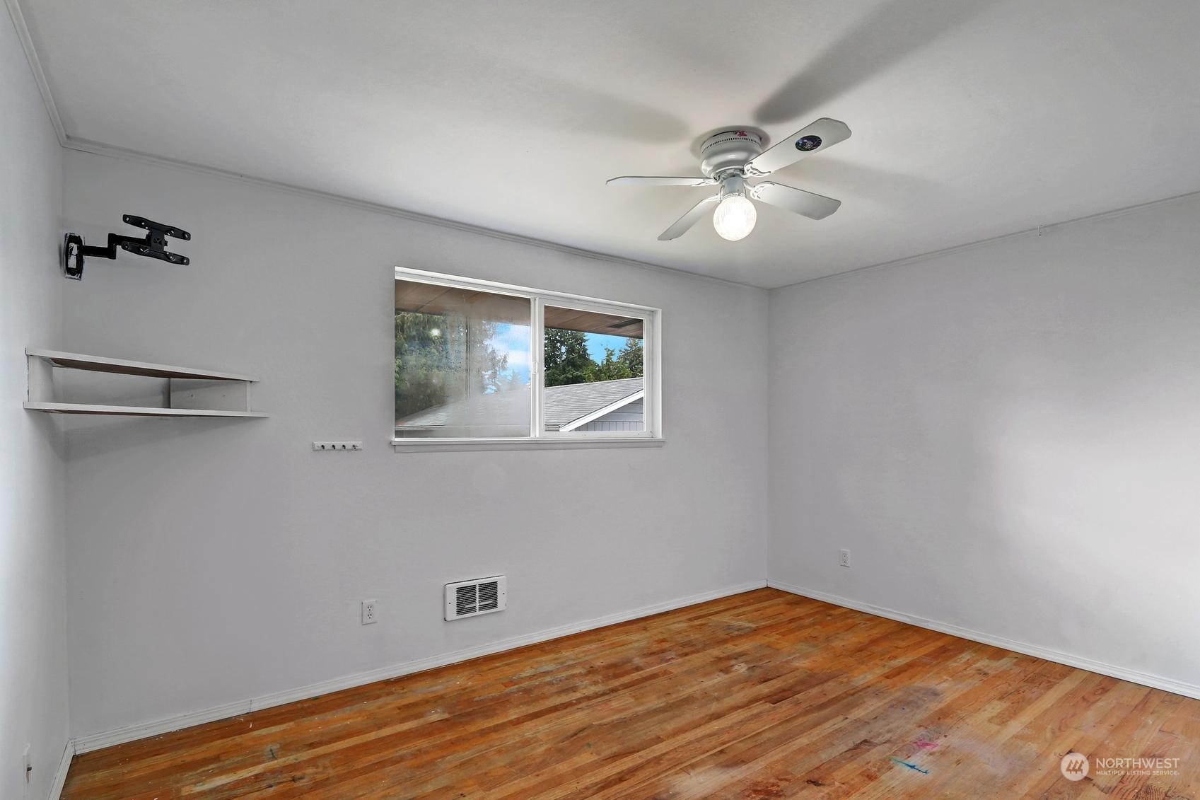 2303 Burley Drive Everett, WA 98208 - Photo 13 of 22 a view of empty room with wooden floor