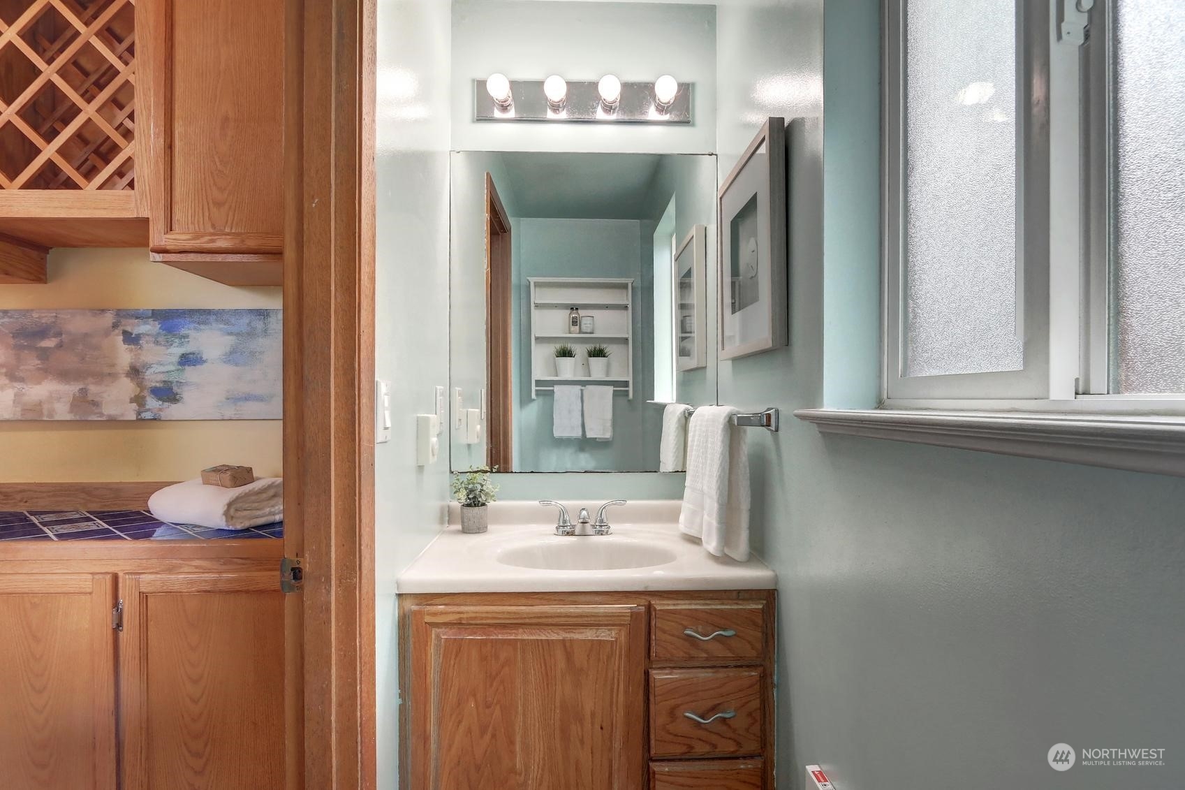 2303 Burley Drive Everett, WA 98208 - Photo 17 of 22 a bathroom with a granite countertop sink and a mirror