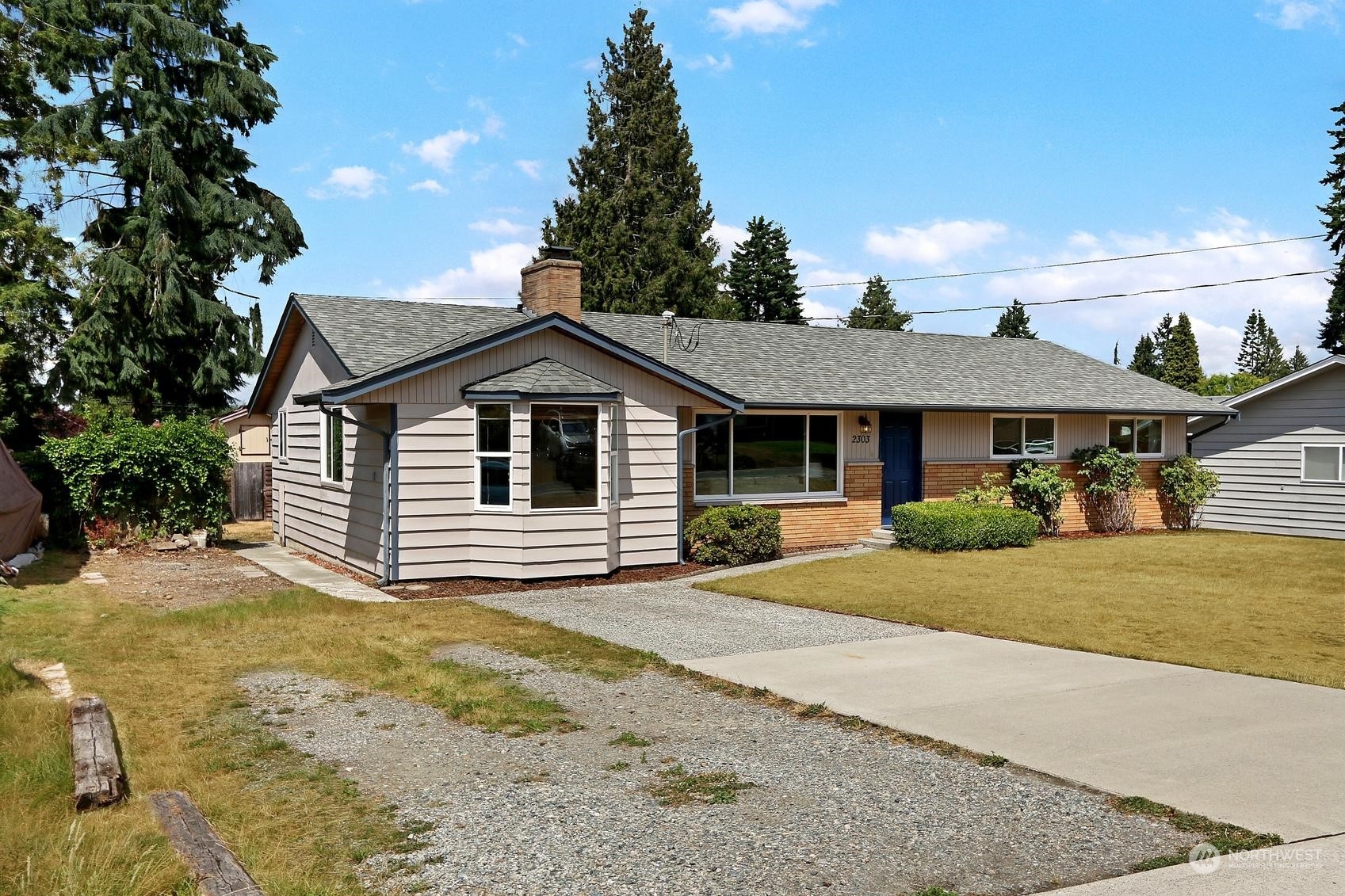 2303 Burley Drive Everett, WA 98208 - Photo 2 of 22 a front view of a house with a garden