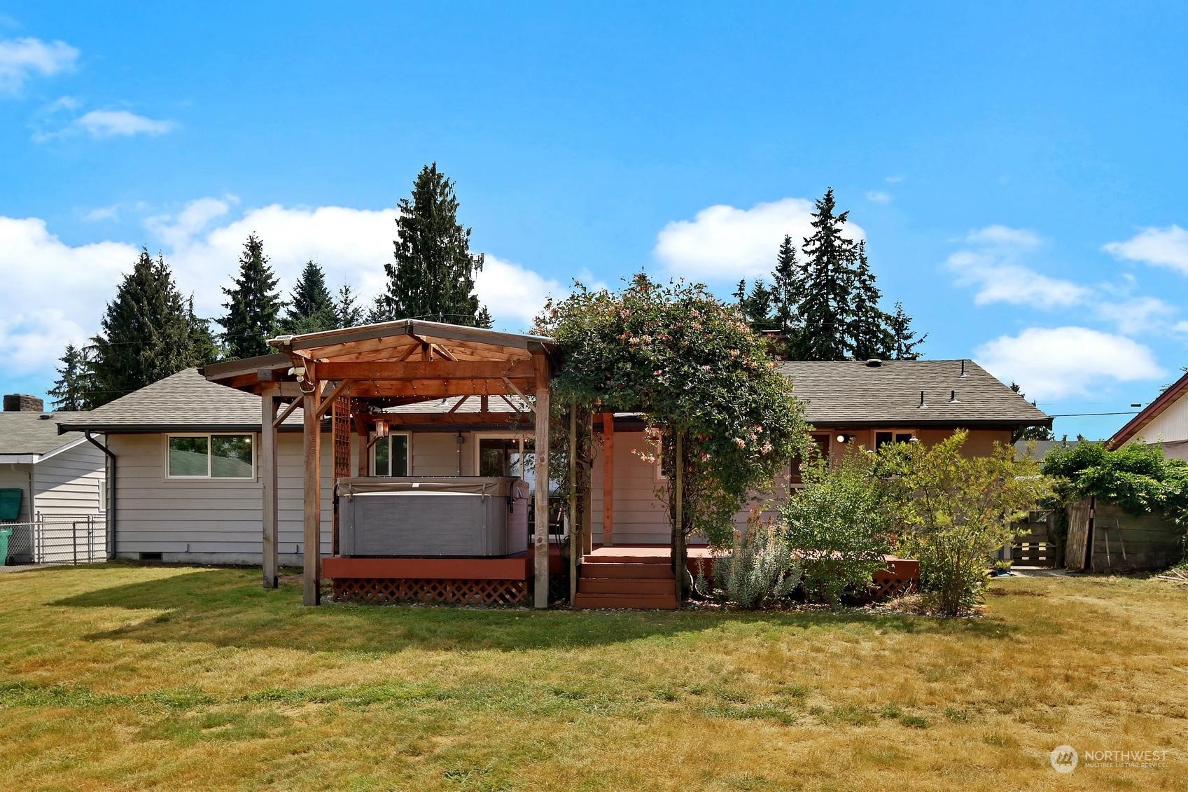 2303 Burley Drive Everett, WA 98208 - Photo 22 of 22 a view of a house with a patio and a yard