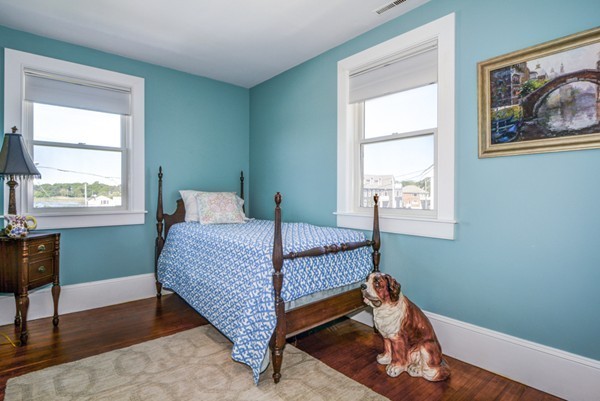 45 Surfside Road Scituate, MA 02066 - Photo 23 of 29 a bedroom with a bed and a window