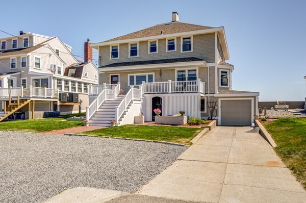 45 Surfside Road Scituate, MA 02066 - Photo 5 of 29 a front view of a house with a yard and garage