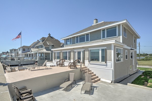 45 Surfside Road Scituate, MA 02066 - Photo 6 of 29 a front view of a building with a yard