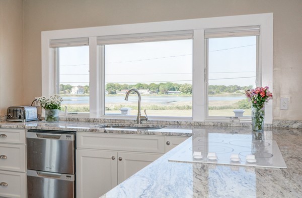 45 Surfside Road Scituate, MA 02066 - Photo 8 of 29 a kitchen with a window a sink and cabinets