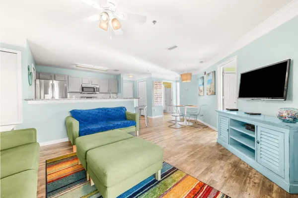 a living room with furniture and a flat screen tv
