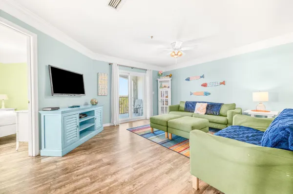 a living room with furniture and a flat screen tv