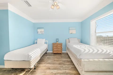 a bedroom with a bed and a couch