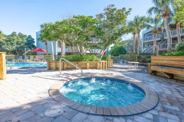 a swimming pool with outdoor seating and yard