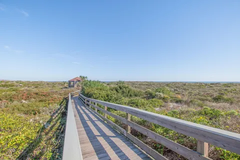 a view of a balcony with wooden floor