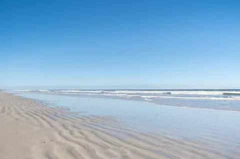 a view of a water heater and a covered with water in the background