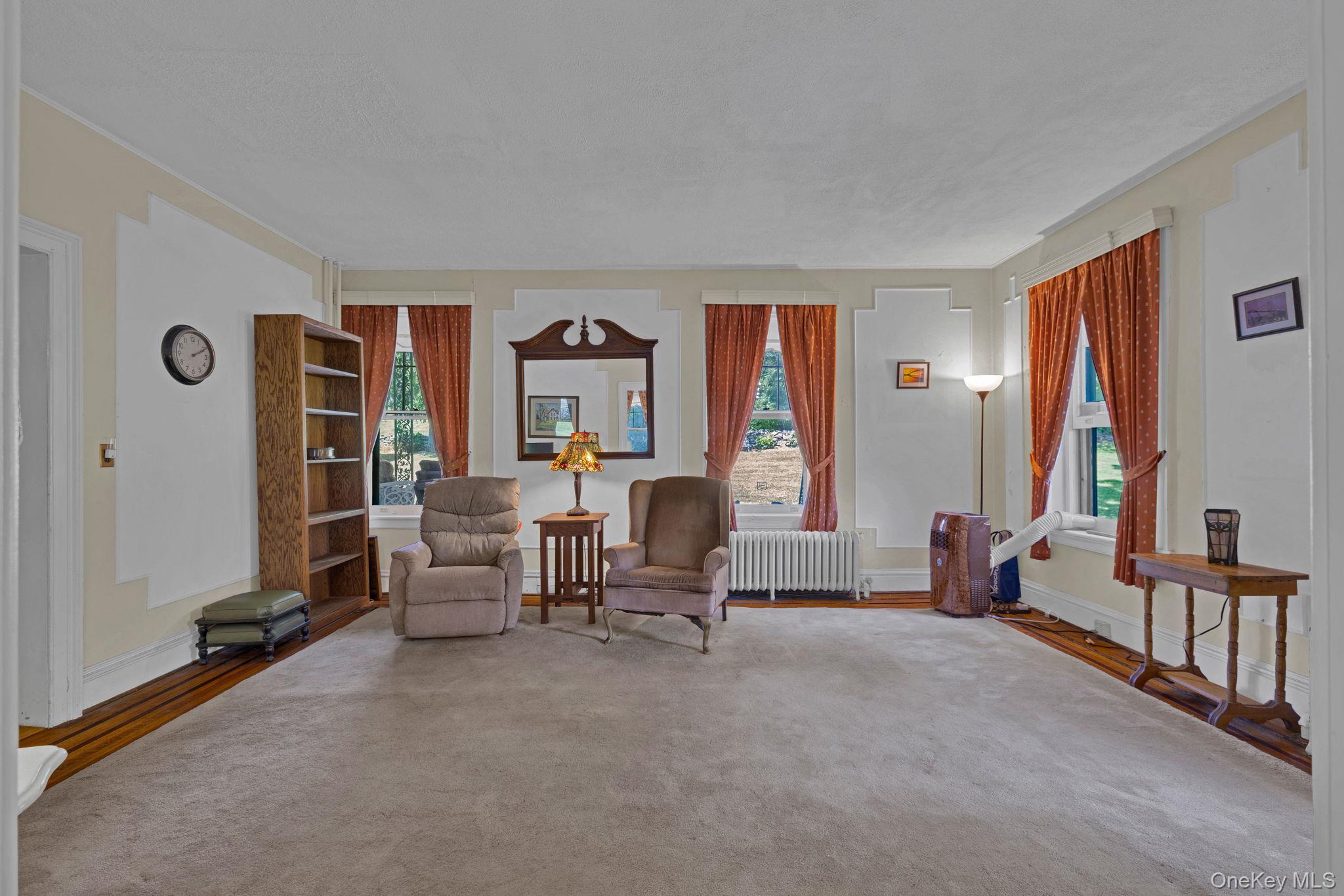 470 Little Britain Road Newburgh, NY 12550 - Photo 20 of 45 Sitting room with radiator and wood finished floors
