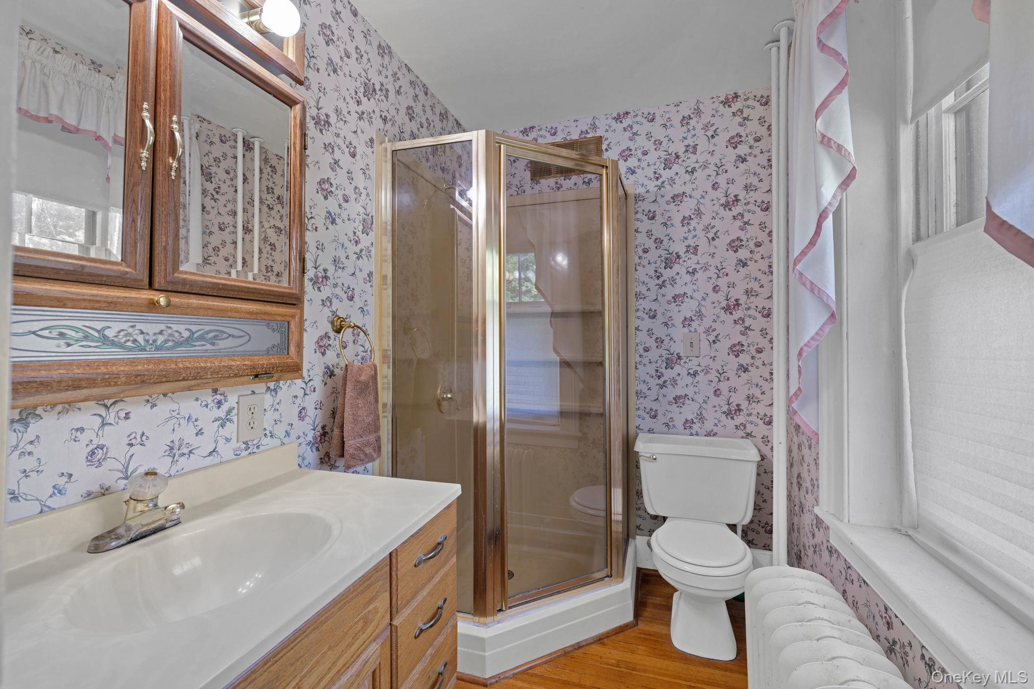 470 Little Britain Road Newburgh, NY 12550 - Photo 31 of 45 Bathroom with radiator, light wood-style floors, vanity, a stall shower, and wallpapered walls