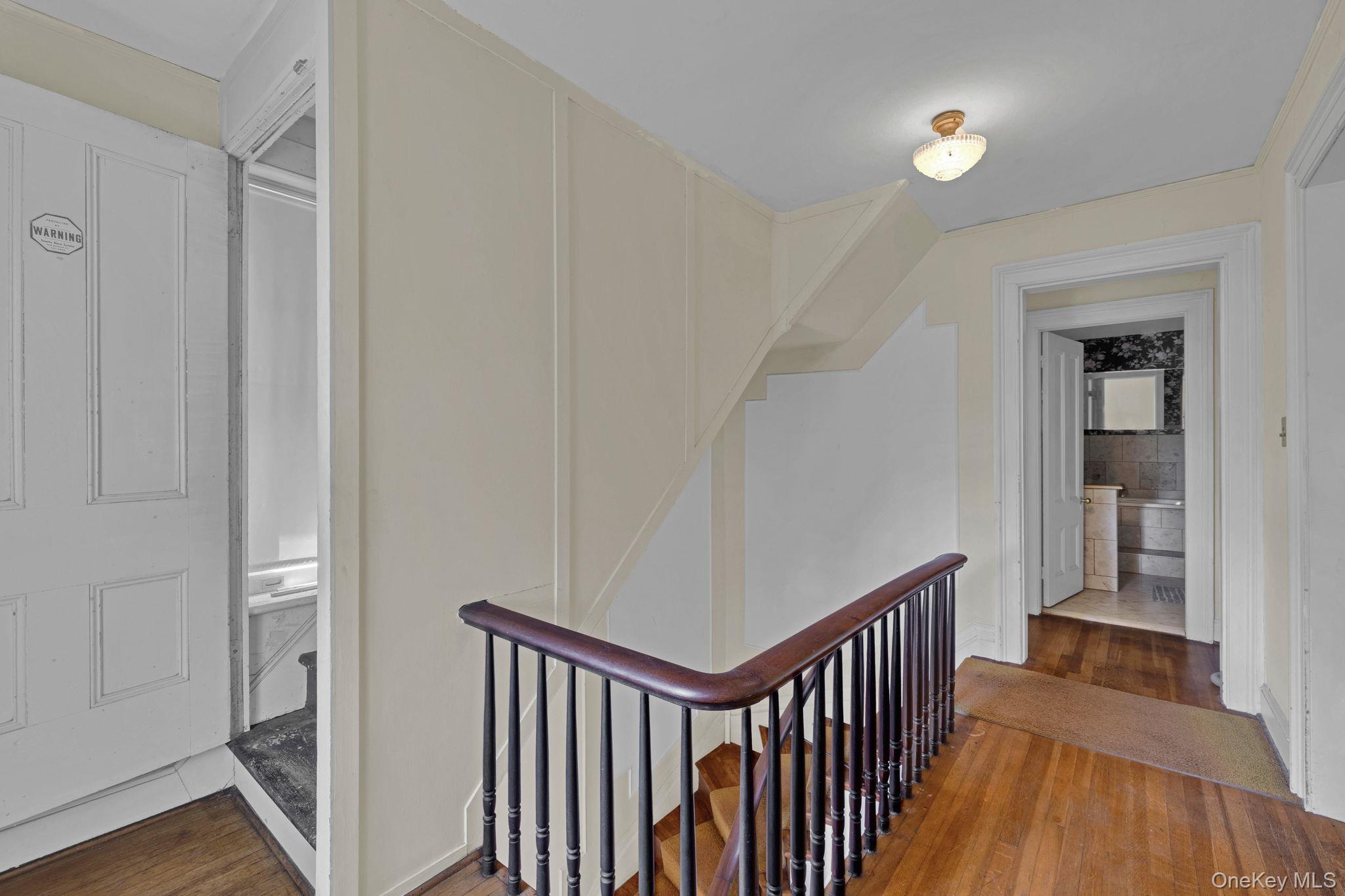470 Little Britain Road Newburgh, NY 12550 - Photo 32 of 45 Corridor with wood finished floors and an upstairs landing