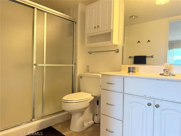 a bed room with a bed and a television