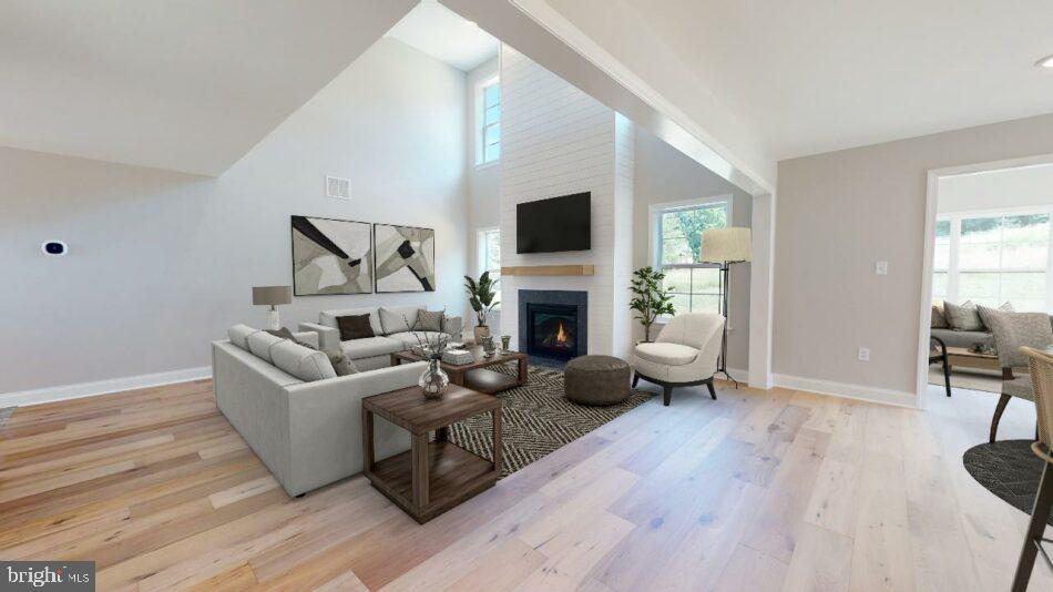 0 Marys Way, Unit ARDMORE Harrisburg, PA 17112 - Photo 7 of 21 a living room with furniture a flat screen tv and a fireplace