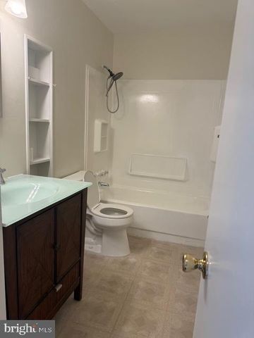 a view of a backyard with couches and a fire pit