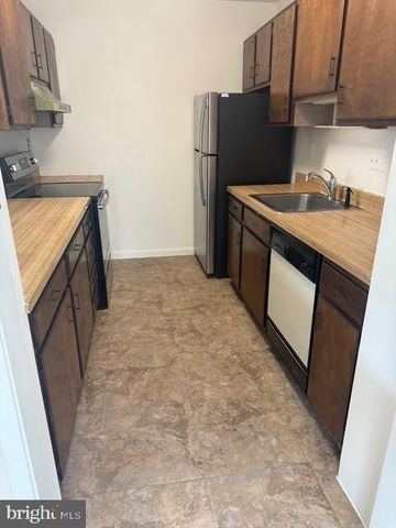 a view of empty room with window and fireplace